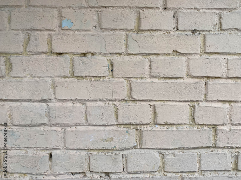White bricks - old surfaces, shabby with seams, painted with white paint. The background. Texture White bricks - old surfaces, shabby with seams, painted with white paint. The background. Texture