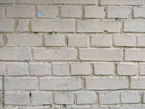 White bricks - old surfaces, shabby with seams, painted with white paint. The background. Texture
