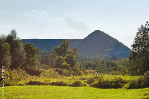 Summer landscape - view of the post-mining waste dump at the mine near the town Rydultowy in the south-western part of the Silesian Highland, Upper Silesia, Poland photo