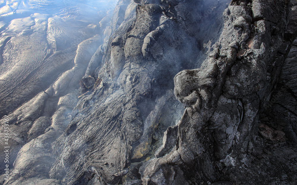 Smoking cracked lava ground closeup texture Smoking cracked lava ground closeup texture