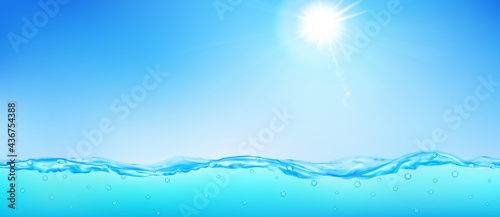 Background with sea wave, blue sky, sun, rays and lens flare
