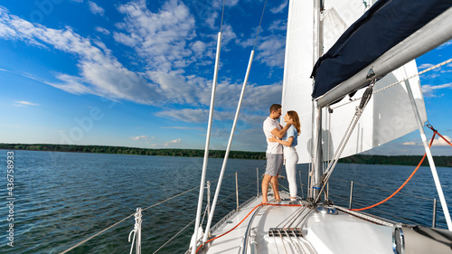 Loving Couple Hugging Standing On Boat Deck Having Date Outdoors