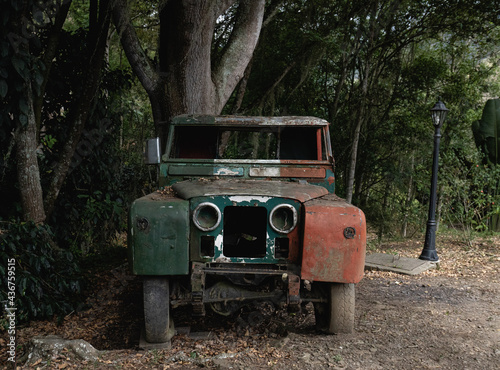 And old vintage car lies on the road