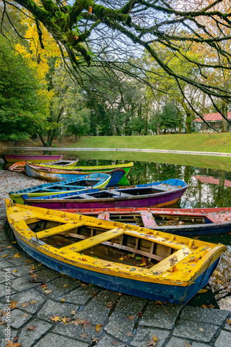 Colorful boats floating in the lake of Bom Jesus, Braga, Portugal in autumn seasons © Vtor