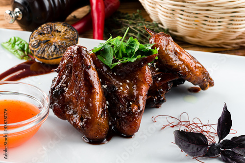 American cuisine. Fried chicken wings glazed in honey sauce