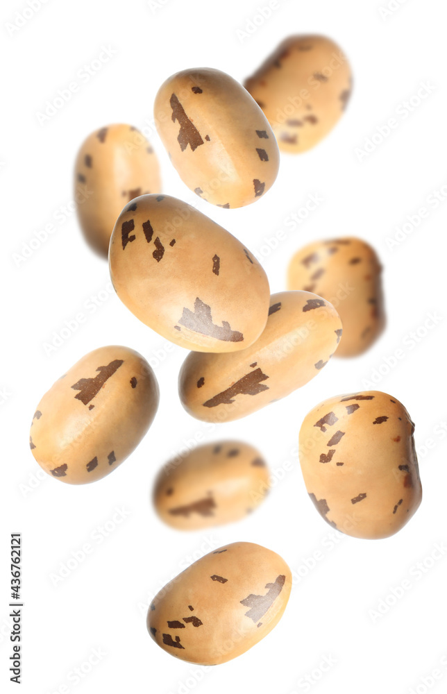 Obraz premium Many beans falling on white background. Vegan diet