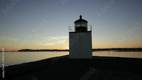 Derby Lighthouse in Salem Harbor, Massachusetts at sunset. photo