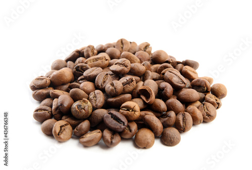 Heap of roasted coffee beans isolated on white © New Africa