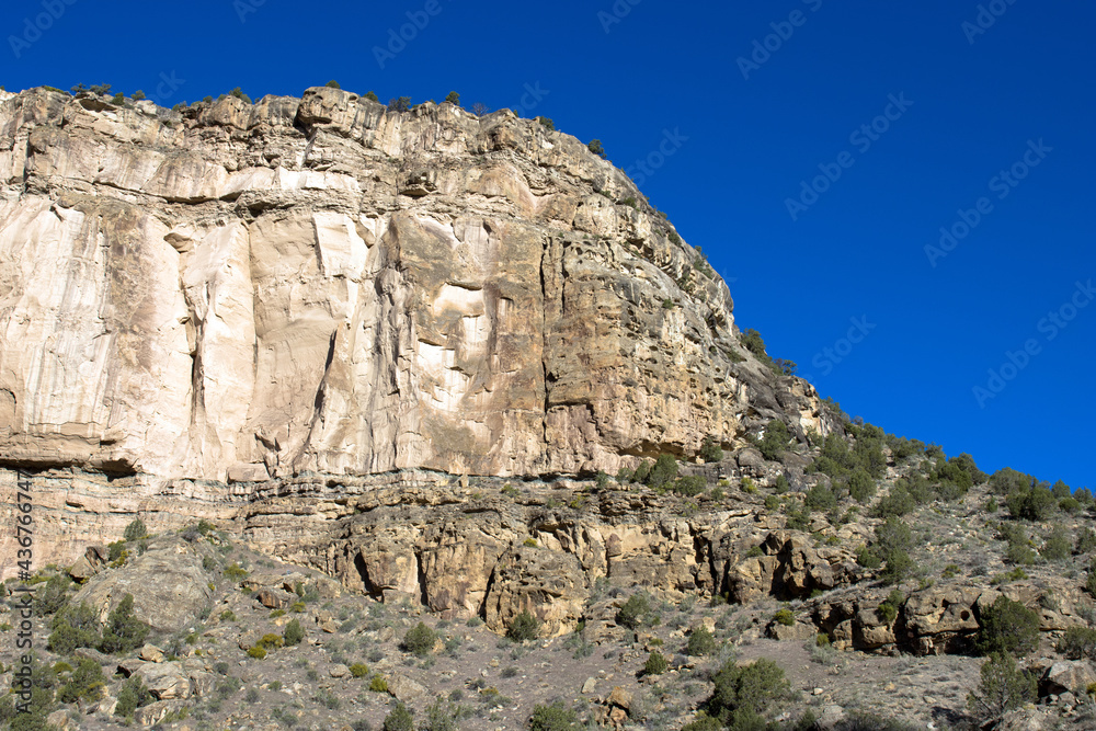 Sheer cliffs rise above Plateau Creek along the scenic byway on Grand Mesa in Colorado