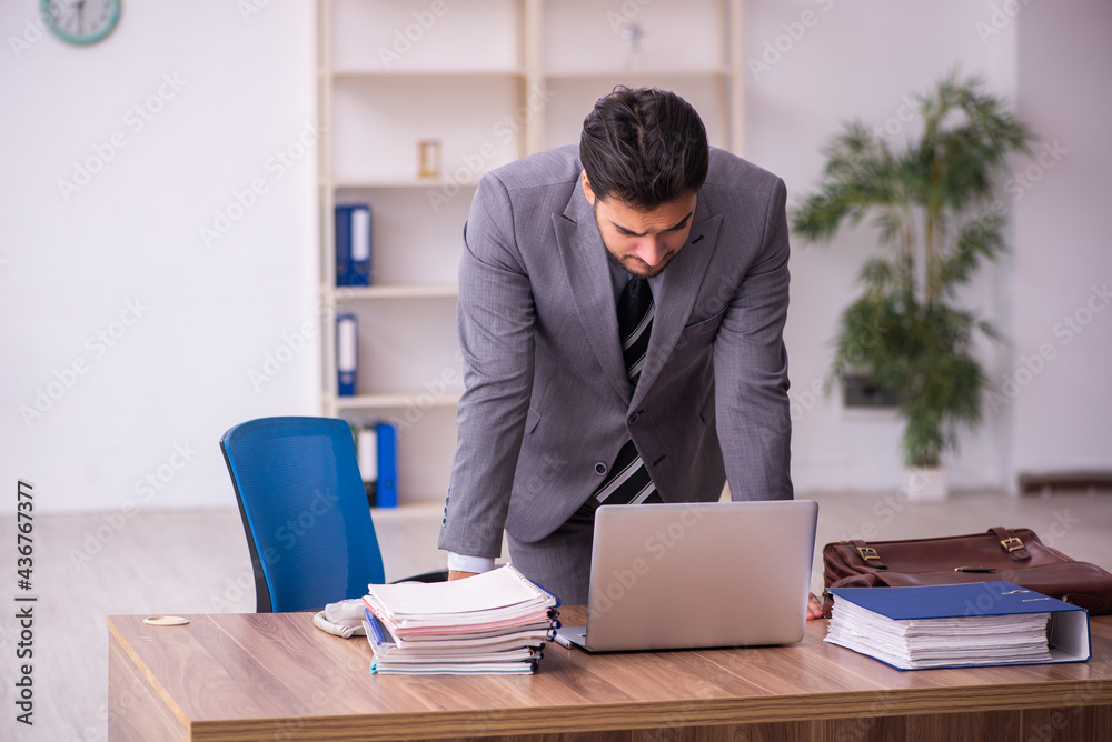 Young businessman employee working in the office Young businessman employee working in the office