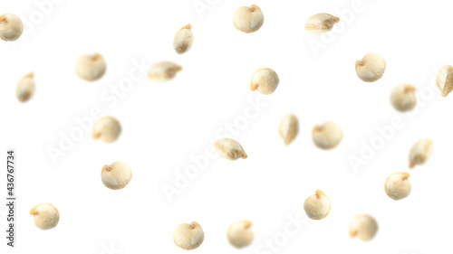 Many quinoa seeds falling on white background, banner design. Vegan diet photo