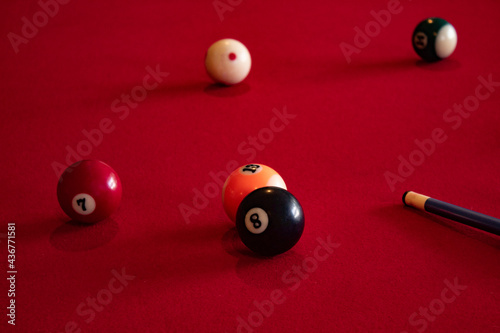 Billiard balls ready to play on a red table