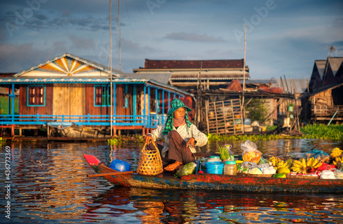 Local Cambodian seller at floating village photo