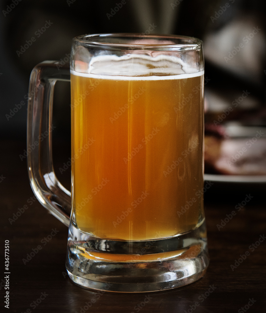 Glass of beer on a table Glass of beer on a table