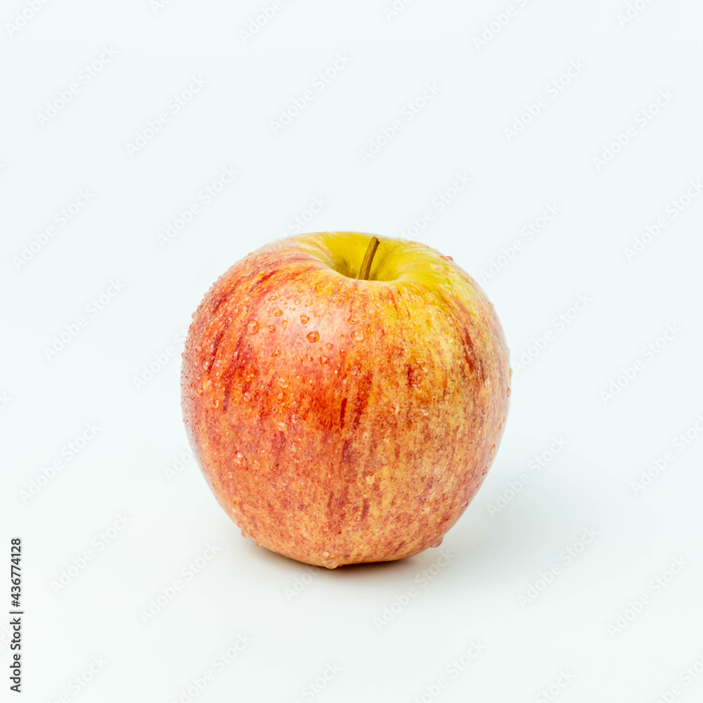 Fresh red apple fruit and water droplets isolated on white background Fresh red apple fruit and water droplets isolated on white background