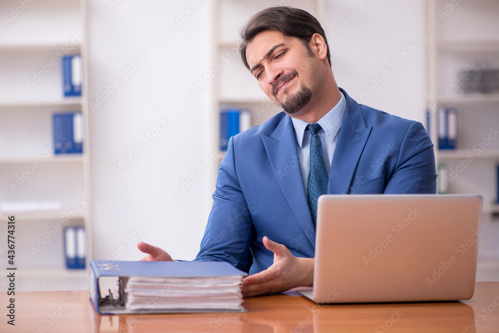 Young businessman employee working in the office Young businessman employee working in the office