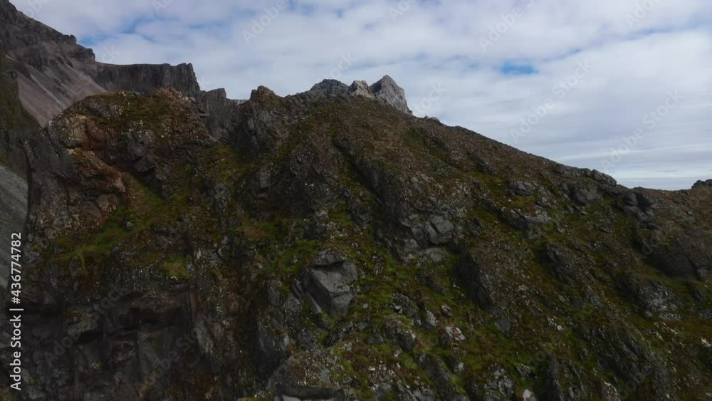 Epic reveal aerial view of Vestrahorn mountains to the beautiful plains. Epic reveal aerial view of Vestrahorn mountains to the beautiful plains.