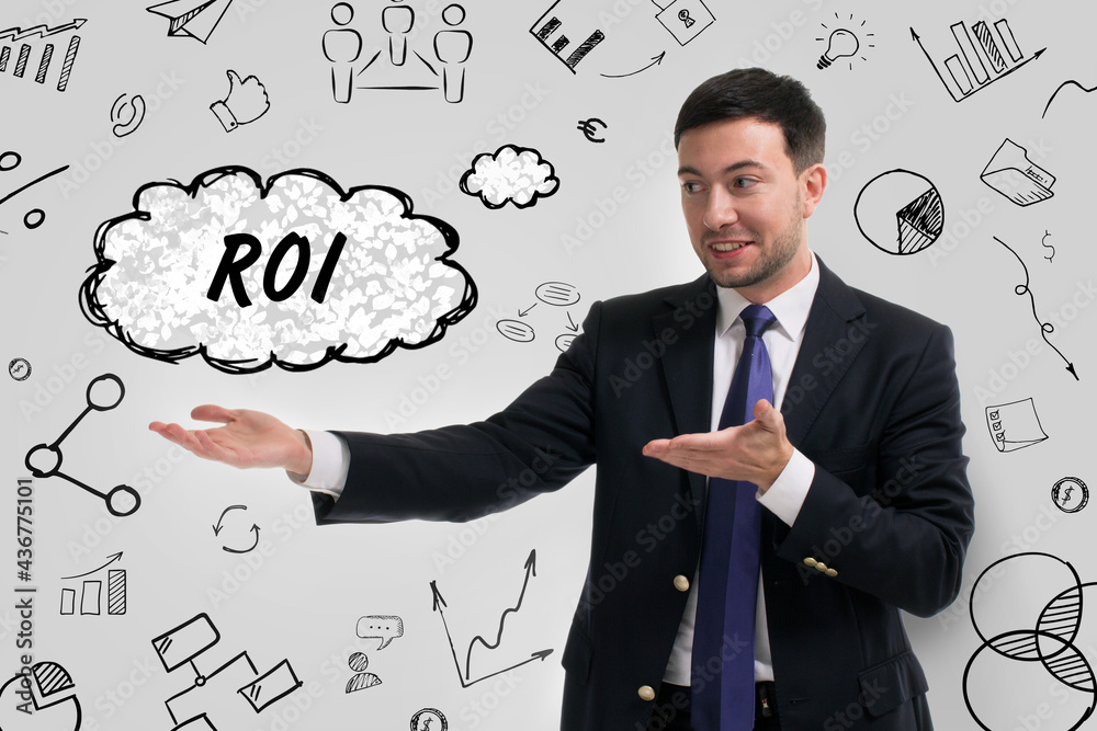 Business, technology, internet and network concept. Young businessman thinks over the steps for successful growth: ROI Business, technology, internet and network concept. Young businessman thinks over the steps for successful growth: ROI