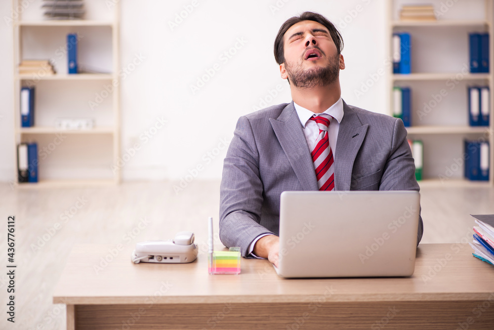 Young businessman employee working in the office Young businessman employee working in the office