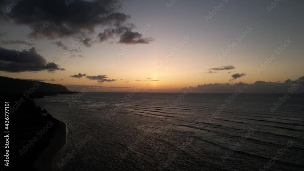 Tranquility Of Nature With Calm Ocean Under Golden Sunset Sky In North Shore, Oahu, Hawaii. - Wide Shot Tranquility Of Nature With Calm Ocean Under Golden Sunset Sky In North Shore, Oahu, Hawaii. - Wide Shot