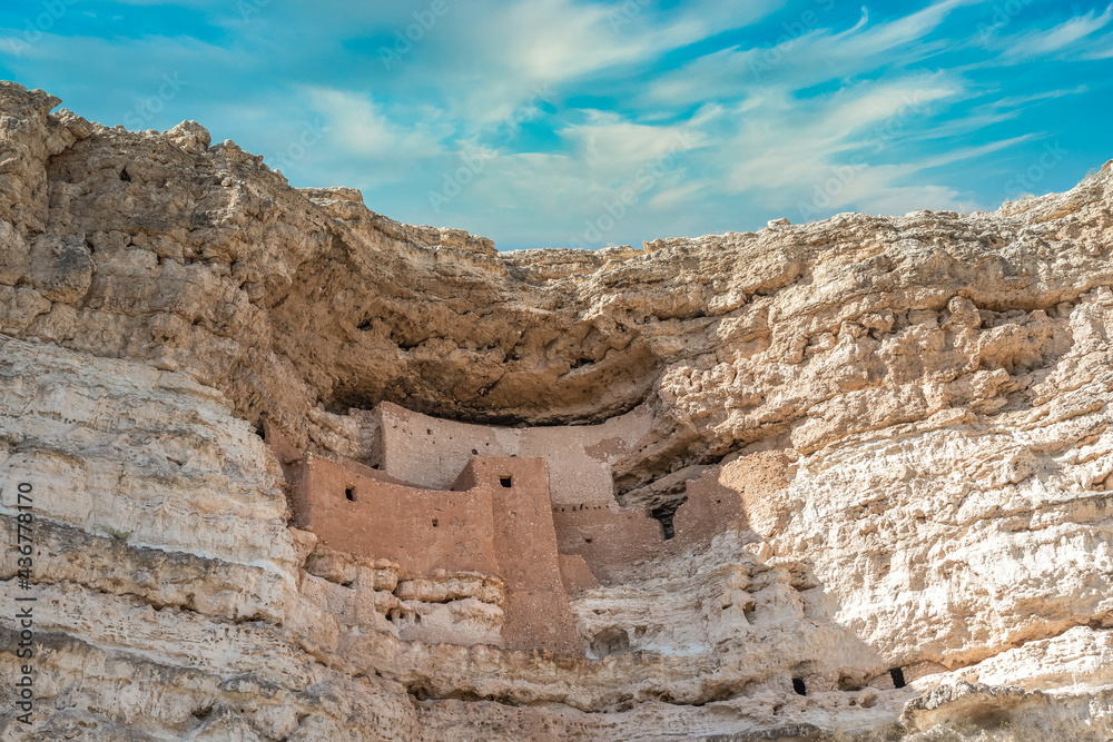 Close-up view of Montezuma castle  National Monument, blue sky ancient cliff dwelling in Camp Verde Arizona by the indigenous Sinagua people, early stone-and-mortar masonry, constructed from limestone