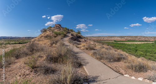 Summer view of Tuzigoot hilltop pueblo National Monument in Arizona in the Verde valley ancient home of the Sinagua people, multi story ruins make of limestone near Clarksdale photo