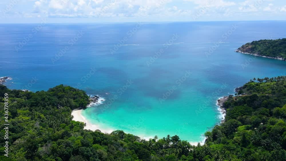 Professional Video 4K. Aerial view shot. Drone camera over white beach sand and sew water clear. Nature video view of beautiful tropical beach and yacht at sea. Freedom beach. At Phuket, Thailand. Professional Video 4K. Aerial view shot. Drone camera over white beach sand and sew water clear. Nature video view of beautiful tropical beach and yacht at sea. Freedom beach. At Phuket, Thailand.