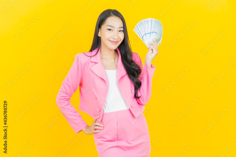 Portrait beautiful young asian woman smile with a lot of cash and money Portrait beautiful young asian woman smile with a lot of cash and money