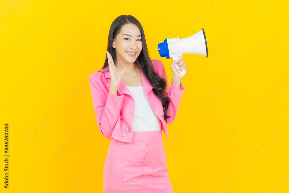 Portrait beautiful young asian woman smile with megaphone Portrait beautiful young asian woman smile with megaphone