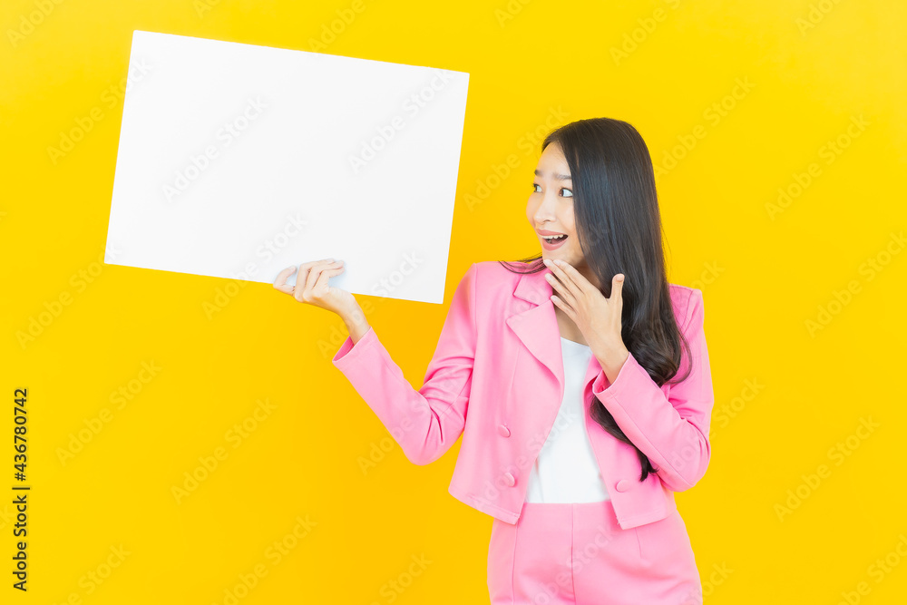 Portrait beautiful young asian woman with empty white billboard Portrait beautiful young asian woman with empty white billboard