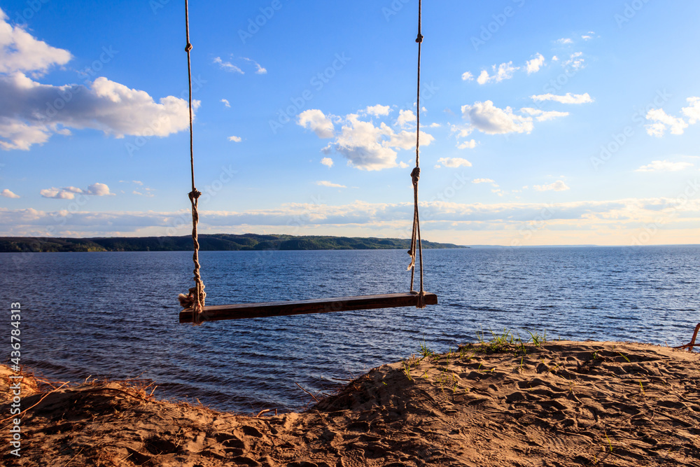Rope swing on a shore of the Dnieper river in Ukraine Rope swing on a shore of the Dnieper river in Ukraine