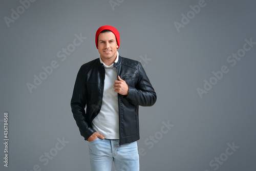 Fashionable young man on gr...
