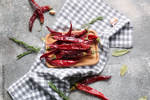 Composition with hot chili pepper on grey background