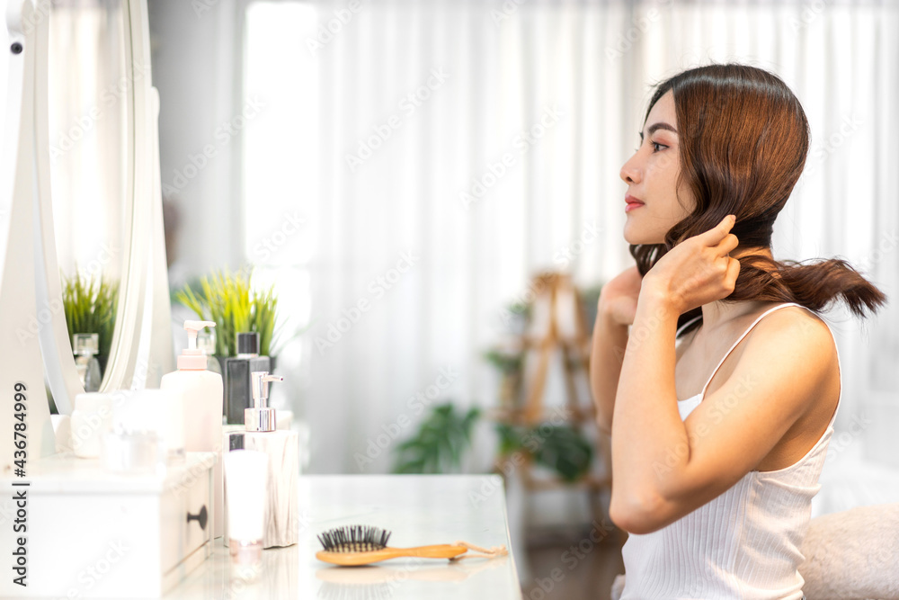 Smiling of cheerful beautiful pretty asian woman beauty clean fresh healthy white skin posing in white clothes.Girl felling relaxing and enjoy time look at mirror in home.asia salon beauty Smiling of cheerful beautiful pretty asian woman beauty clean fresh healthy white skin posing in white clothes.Girl felling relaxing and enjoy time look at mirror in home.asia salon beauty