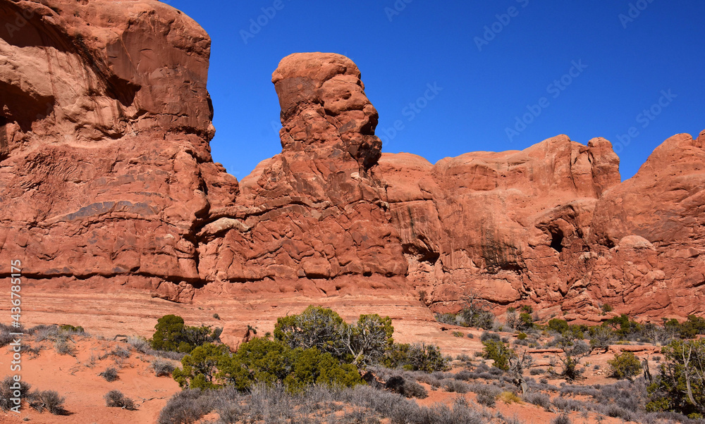 sphinxlike rock formation near double arch on a sunny day, in arches national park, utah