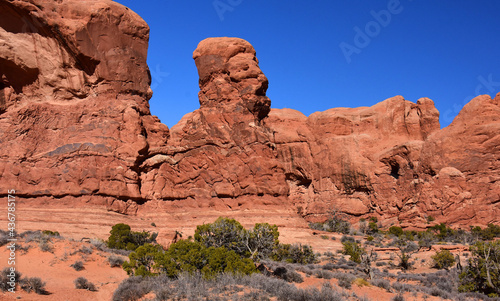 sphinxlike rock formation near double arch on a sunny day, in arches national park, utah