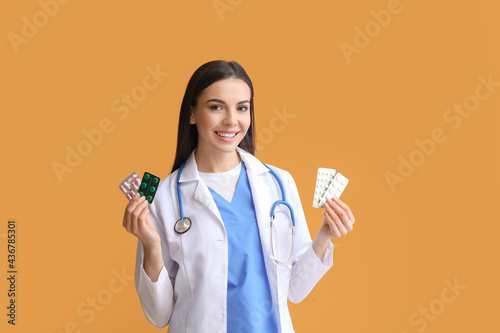 Female doctor with pills on...