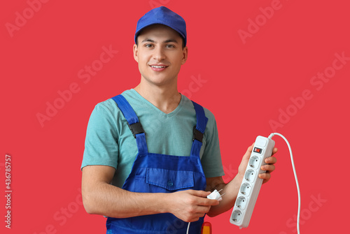 Young electrician with exte...