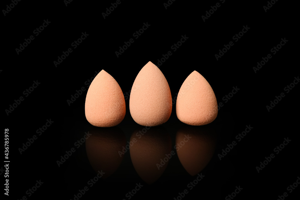 Makeup sponges on dark background Makeup sponges on dark background