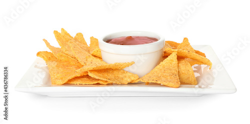 Plate with tasty nachos and sauce on white background
