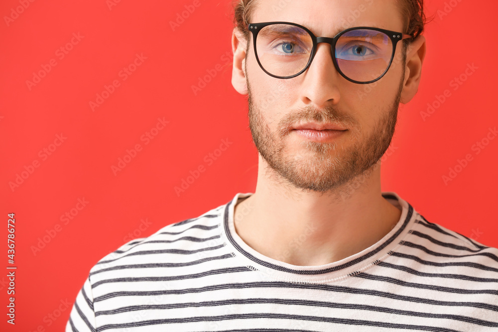 Young man wearing eyeglasses on color background Young man wearing eyeglasses on color background