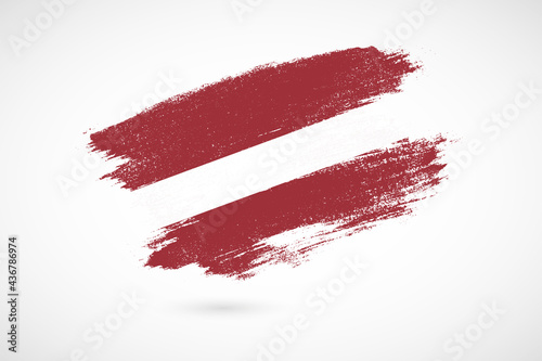 Happy independence day of Latvia with vintage style brush flag background