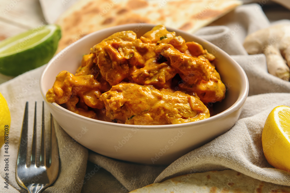 Bowl of tasty chicken tikka masala on table Bowl of tasty chicken tikka masala on table