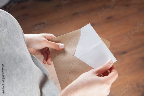 young girl opened an envelope