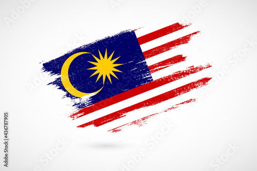 Happy independence day of Malaysia with vintage style brush flag background