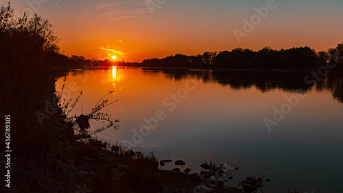 Beautiful sunset with reflections near Stephansposching, Danube, Bavaria, Germany © Martin Erdniss