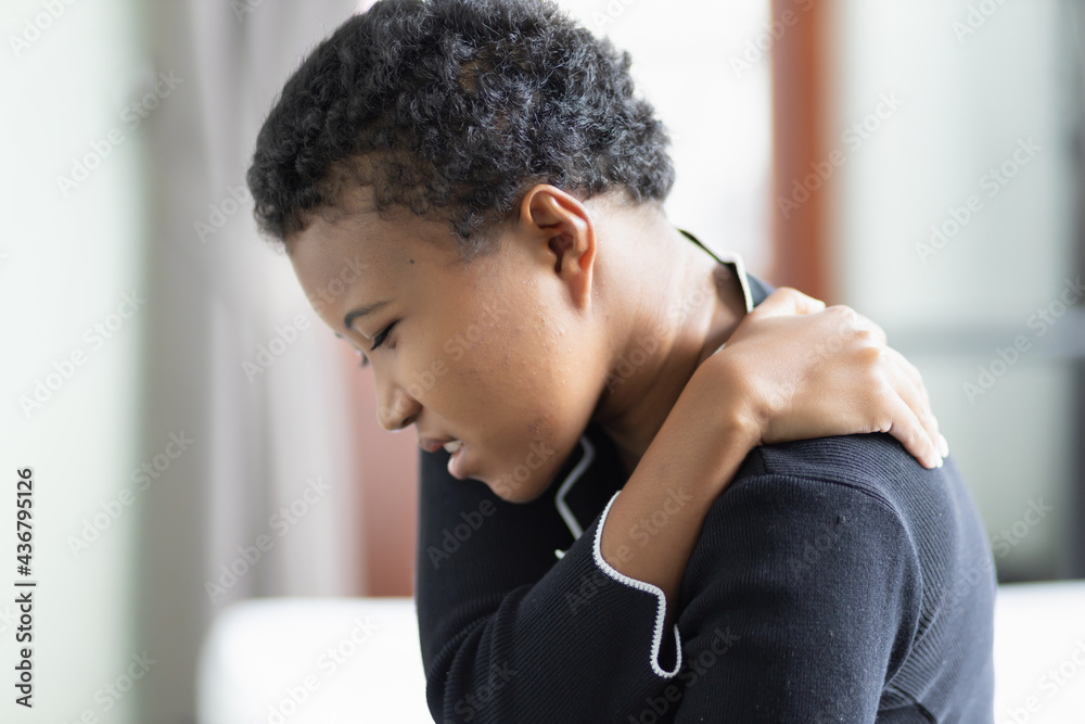 Black African woman suffers from shoulder joint pain, shoulder stiffness or osteoporosis or having pain at injection site as a side adverse effect after vaccination at upper arm muscle Black African woman suffers from shoulder joint pain, shoulder stiffness or osteoporosis or having pain at injection site as a side adverse effect after vaccination at upper arm muscle