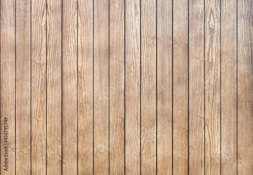 Stylish contemporary wainscoting made of thin light toned ash timber planks as textured background for design close view photo