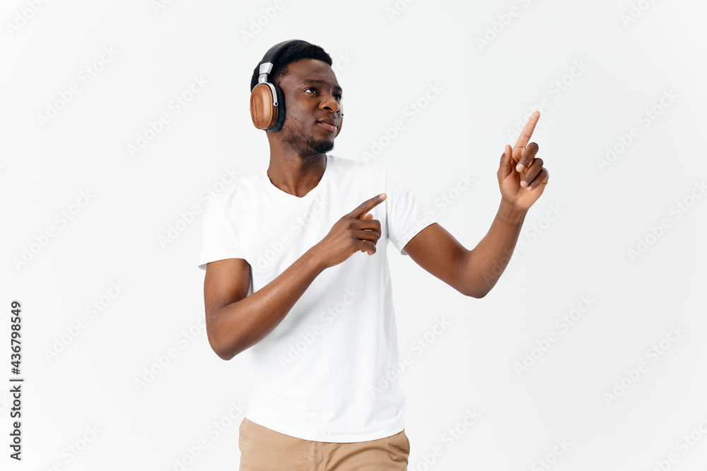 Fototapeta premium African American in headphones music gestures with hands emotions