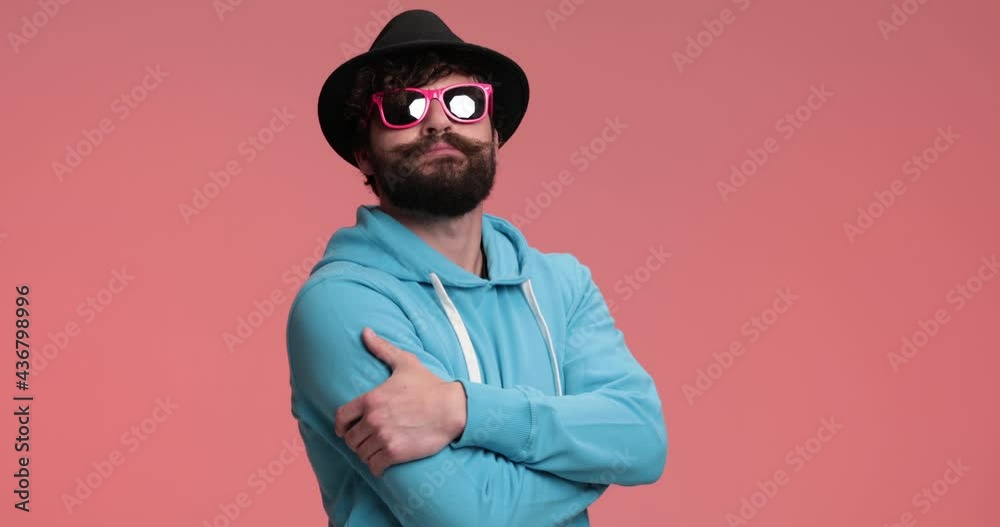 handsome casual man standing with his arms crossed, shaking his head with attitude handsome casual man standing with his arms crossed, shaking his head with attitude